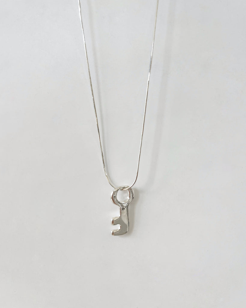 Llave Pendant in Silver